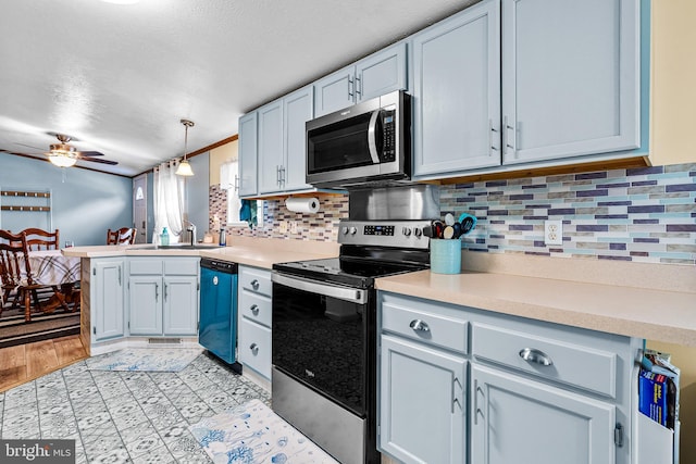 315 Robinhood Rd, Havre De Grace, MD 21078 - kitchen featuring stainless steel appliances, a sink, a peninsula, light countertops, and ceiling fan