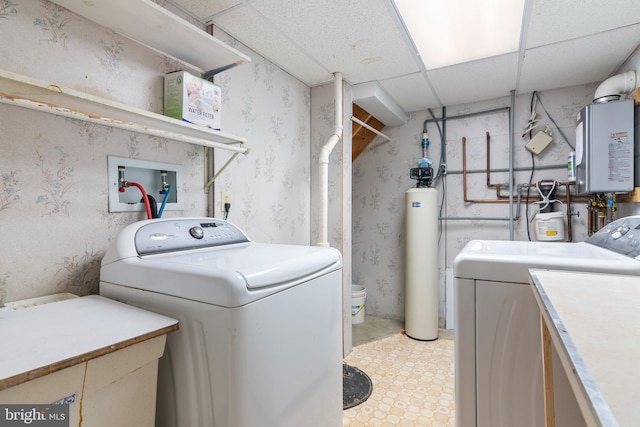 29414 Andrew Ln, Easton, MD 21601 - laundry area with washing machine and clothes dryer, water heater, wallpapered walls, and light floors