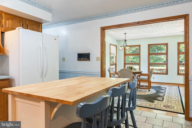 29414 Andrew Ln, Easton, MD 21601 - dining room featuring light tile patterned flooring and a chandelier