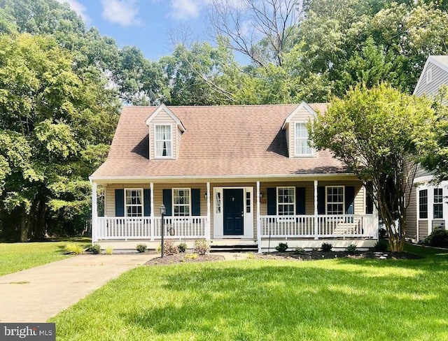 6406 Fisher Ct, Waldorf, MD 20603 - cape cod house with covered porch and a front yard