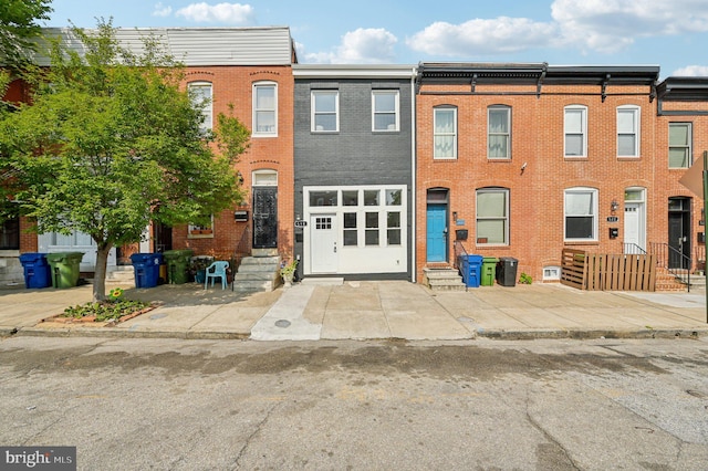 518 N Patterson Park Ave, Baltimore, MD 21205 - townhome / multi-family property featuring brick siding and entry steps