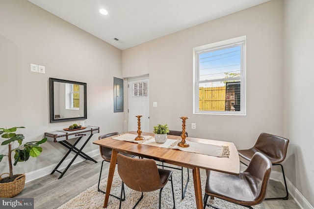 518 N Patterson Park Ave, Baltimore, MD 21205 - dining area with baseboards, light wood-type flooring, electric panel, a desk, and recessed lighting