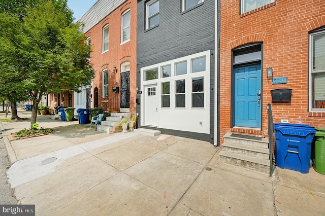 518 N Patterson Park Ave, Baltimore, MD 21205 - view of exterior entry featuring brick siding
