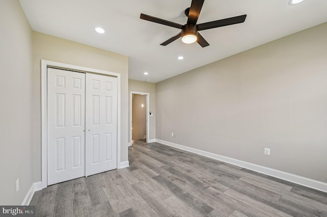 518 N Patterson Park Ave, Baltimore, MD 21205 - unfurnished bedroom featuring wood finished floors, recessed lighting, a closet, baseboards, and ceiling fan