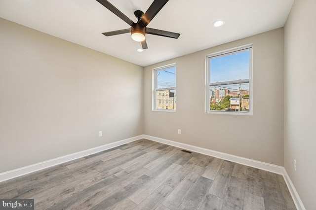 518 N Patterson Park Ave, Baltimore, MD 21205 - spare room featuring ceiling fan, baseboards, wood finished floors, and recessed lighting
