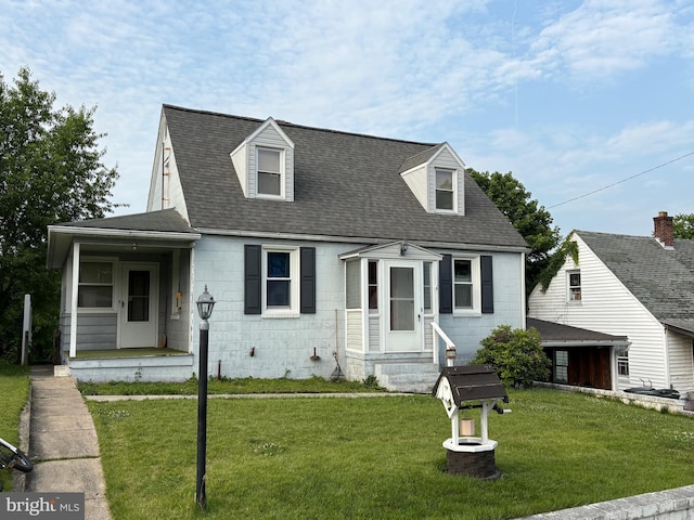 1016 Beechwood Dr, Hagerstown, MD 21742 - cape cod house with concrete block siding, a front yard, and roof with shingles