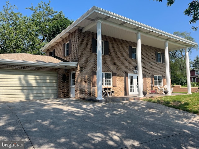 896 Hershey Heights Rd, Hanover, PA 17331 - neoclassical home with brick siding, concrete driveway, and an attached garage