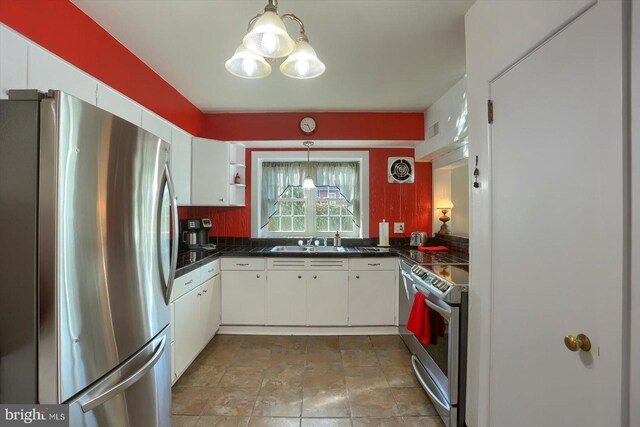 896 Hershey Heights Rd, Hanover, PA 17331 - kitchen featuring appliances with stainless steel finishes, a sink, white cabinetry, and hanging light fixtures