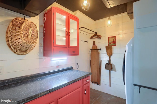 896 Hershey Heights Rd, Hanover, PA 17331 - kitchen with dark countertops, glass insert cabinets, dark tile patterned flooring, and hanging light fixtures