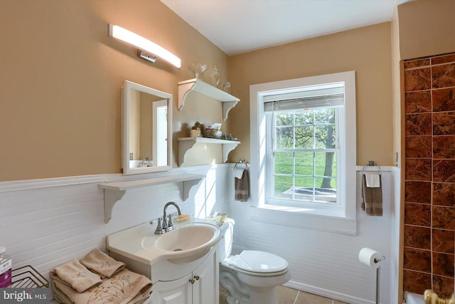896 Hershey Heights Rd, Hanover, PA 17331 - bathroom featuring wainscoting, toilet, tile walls, and vanity