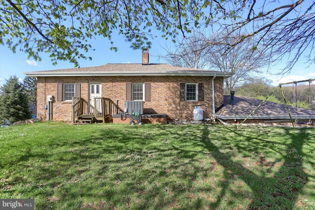 896 Hershey Heights Rd, Hanover, PA 17331 - back of property featuring a lawn, brick siding, and a chimney