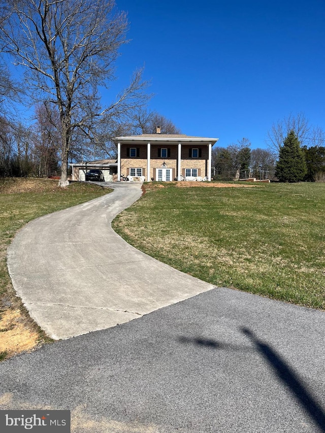 896 Hershey Heights Rd, Hanover, PA 17331 - greek revival inspired property with a chimney, a front lawn, and driveway