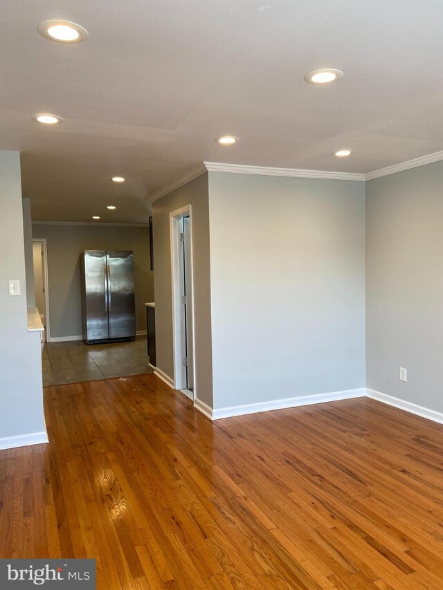7053 Paschall Ave, Philadelphia, PA 19142 - empty room with ornamental molding, wood finished floors, recessed lighting, and baseboards