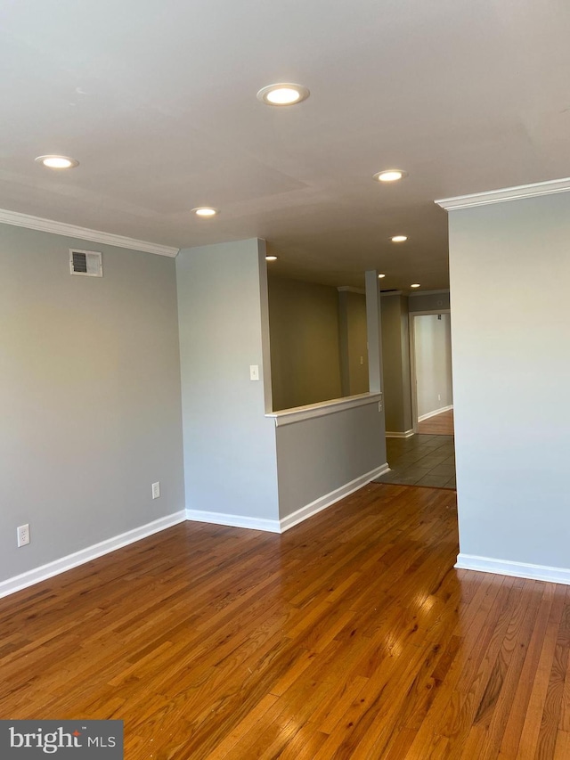 7053 Paschall Ave, Philadelphia, PA 19142 - spare room with ornamental molding, wood-type flooring, baseboards, and recessed lighting