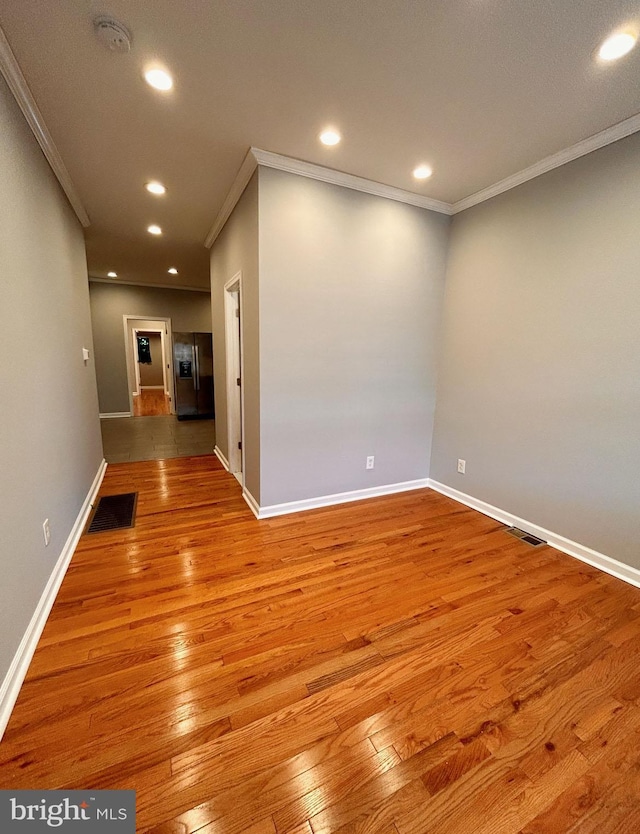 7053 Paschall Ave, Philadelphia, PA 19142 - empty room featuring crown molding, hardwood / wood-style flooring, a smoke detector, baseboards, and recessed lighting