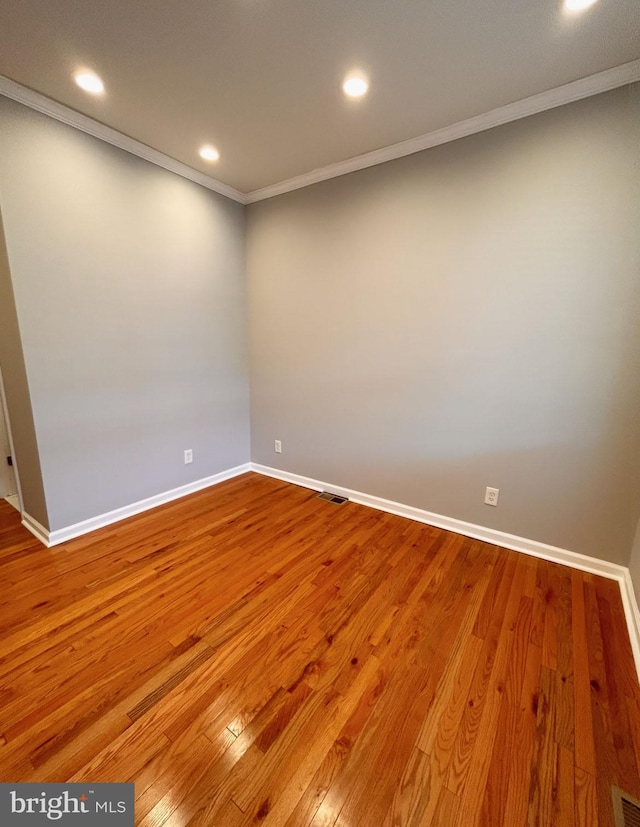 7053 Paschall Ave, Philadelphia, PA 19142 - empty room with crown molding, baseboards, wood finished floors, and recessed lighting