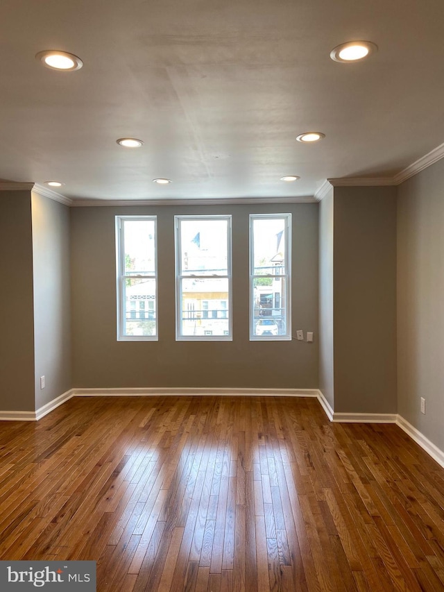 7053 Paschall Ave, Philadelphia, PA 19142 - unfurnished room with dark wood finished floors, healthy amount of natural light, crown molding, baseboards, and recessed lighting