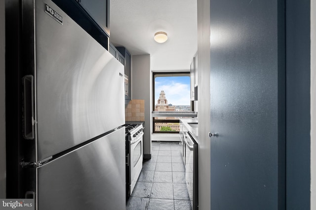 210 Locust St Unit 19Gw, Philadelphia, PA 19106 - kitchen featuring appliances with stainless steel finishes, stone tile floors, and backsplash