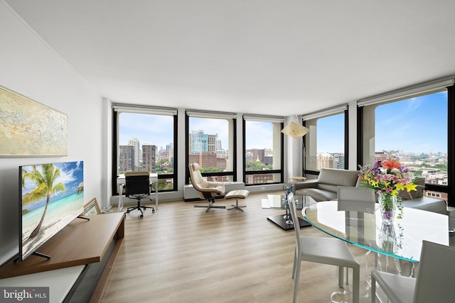 210 Locust St Unit 19Gw, Philadelphia, PA 19106 - living area featuring a view of skyline, wood finished floors, and a wall of windows