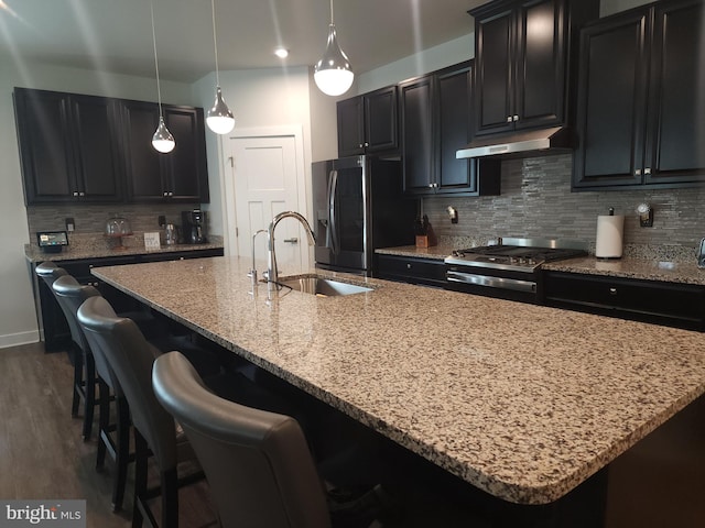 114 Furies St, Smyrna, DE 19977 - kitchen with a sink, fridge with ice dispenser, under cabinet range hood, and dark cabinetry