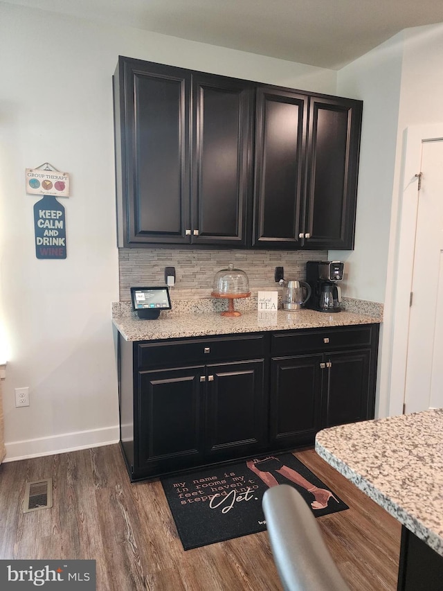114 Furies St, Smyrna, DE 19977 - kitchen featuring dark cabinetry, decorative backsplash, dark wood-type flooring, and baseboards