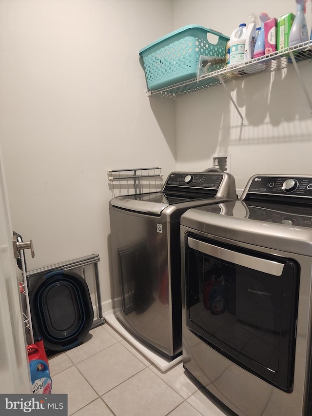 114 Furies St, Smyrna, DE 19977 - washroom featuring separate washer and dryer and light tile patterned floors