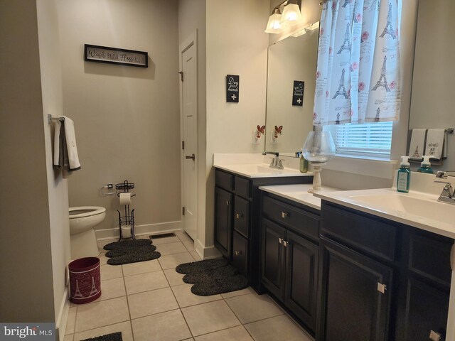 114 Furies St, Smyrna, DE 19977 - bathroom featuring tile patterned flooring, double vanity, toilet, and baseboards
