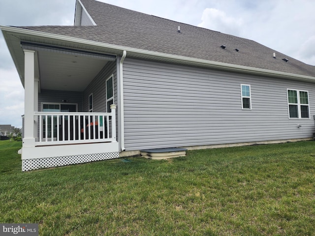 114 Furies St, Smyrna, DE 19977 - view of side of property with a lawn and a shingled roof
