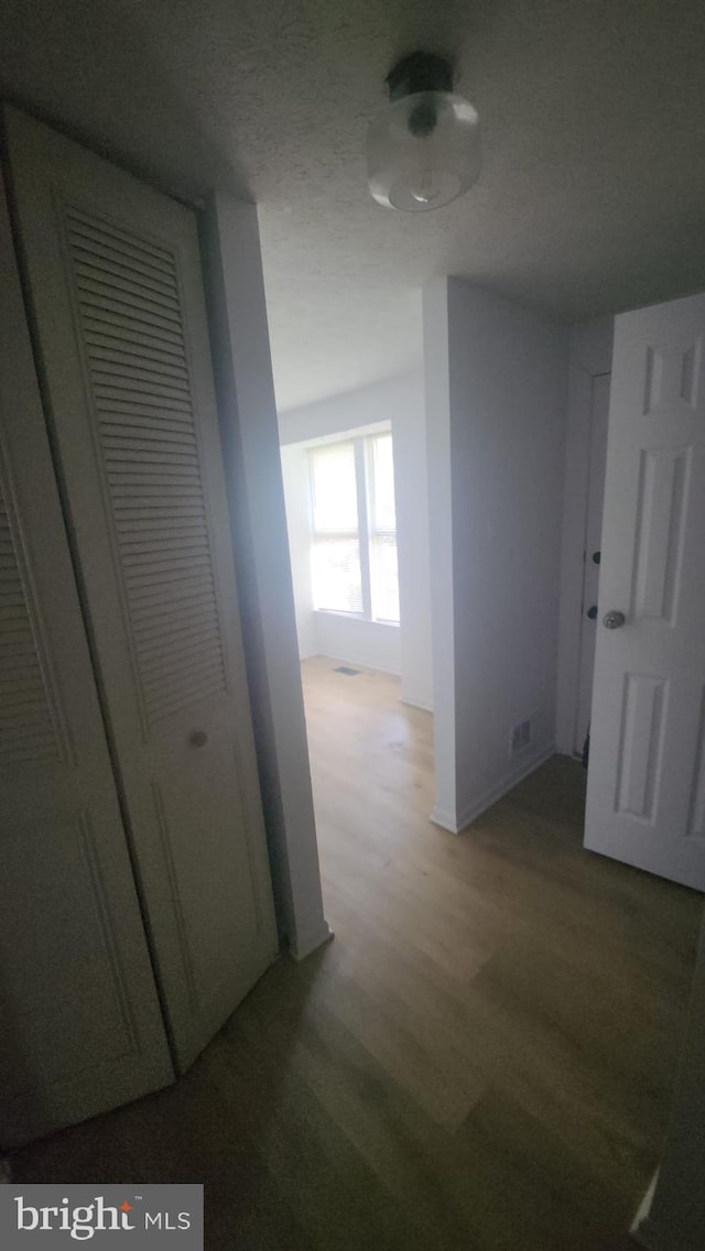 7539 Rain Flower Way, Columbia, MD 21046 - hallway with wood finished floors and baseboards