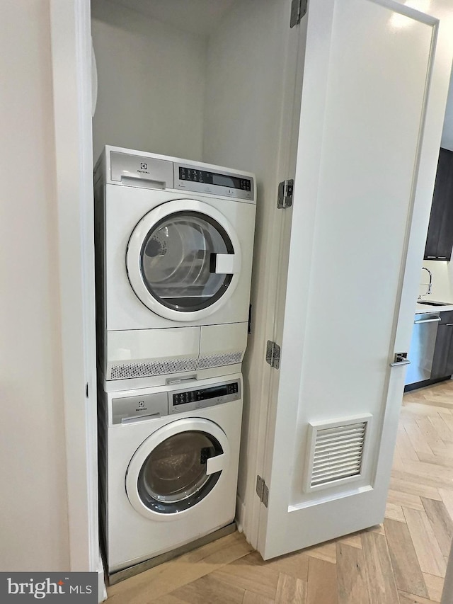 1753 Willard St NW Unit 3, Washington, DC 20009 - laundry area featuring stacked washing machine and dryer
