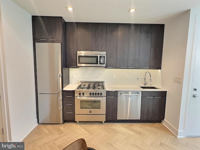 1753 Willard St NW Unit 3, Washington, DC 20009 - kitchen featuring stainless steel appliances, a sink, light countertops, baseboards, and recessed lighting