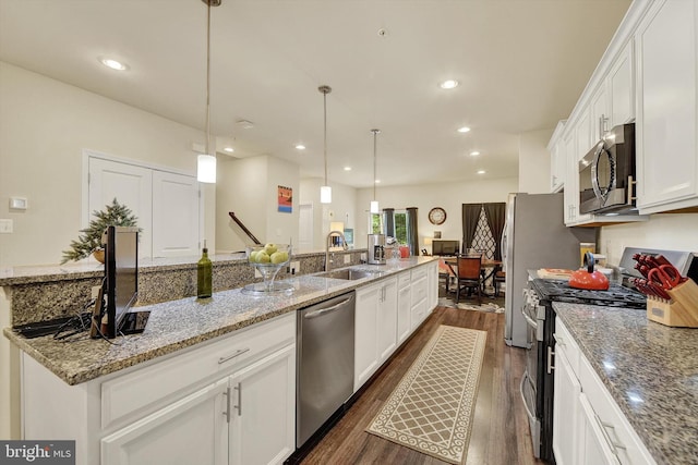 8346 Daydream Cres, Pasadena, MD 21122 - kitchen featuring appliances with stainless steel finishes, a sink, dark wood finished floors, white cabinets, and light stone counters
