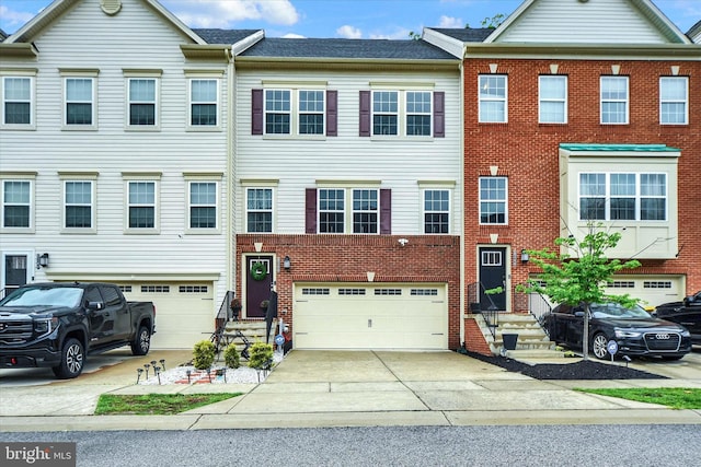 8346 Daydream Cres, Pasadena, MD 21122 - townhome / multi-family property featuring a garage, brick siding, and driveway