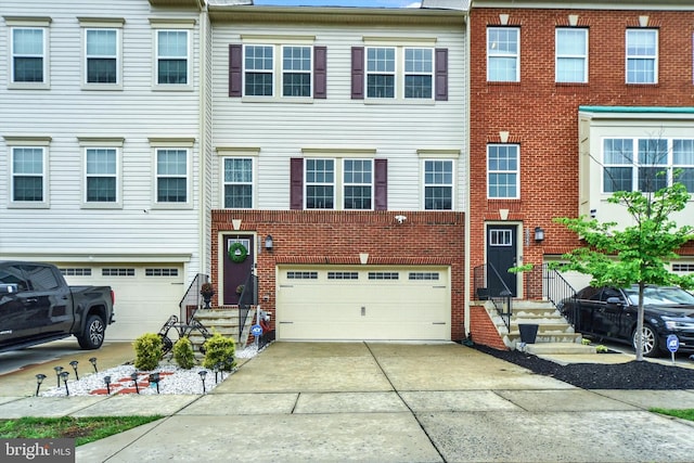 8346 Daydream Cres, Pasadena, MD 21122 - view of property with a garage, concrete driveway, entry steps, and brick siding