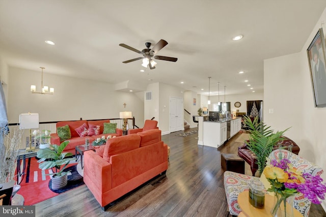 8346 Daydream Cres, Pasadena, MD 21122 - living area featuring recessed lighting, dark wood-type flooring, ceiling fan, a chandelier, and stairway
