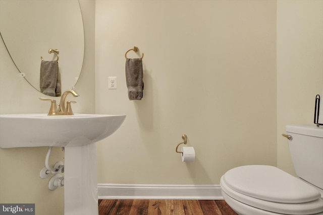 8346 Daydream Cres, Pasadena, MD 21122 - bathroom featuring baseboards, toilet, and wood finished floors