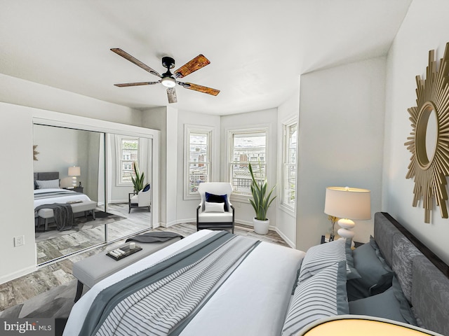 5849 Washington Ave, Philadelphia, PA 19143 - bedroom featuring wood finished floors, baseboards, ceiling fan, and a closet