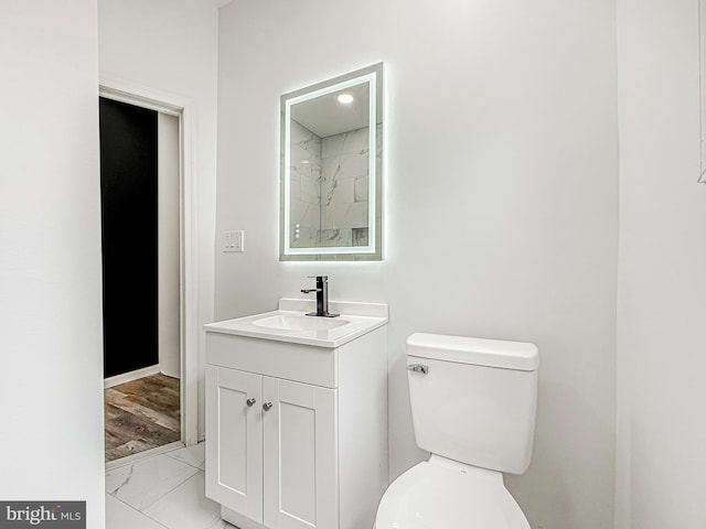 5849 Washington Ave, Philadelphia, PA 19143 - bathroom featuring marble finish floors, vanity, and toilet