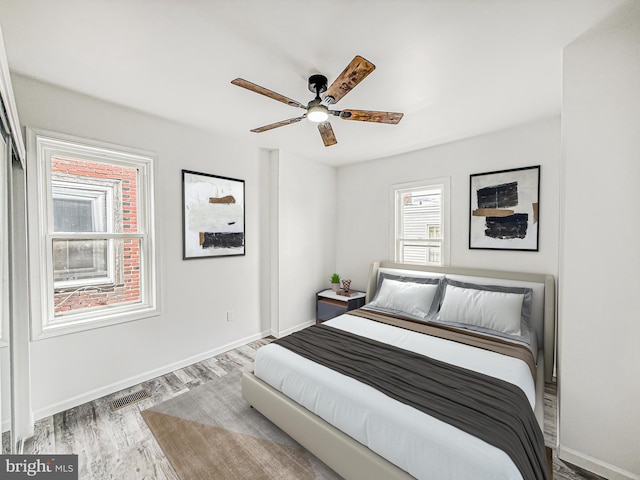 5849 Washington Ave, Philadelphia, PA 19143 - bedroom with wood finished floors, baseboards, and ceiling fan