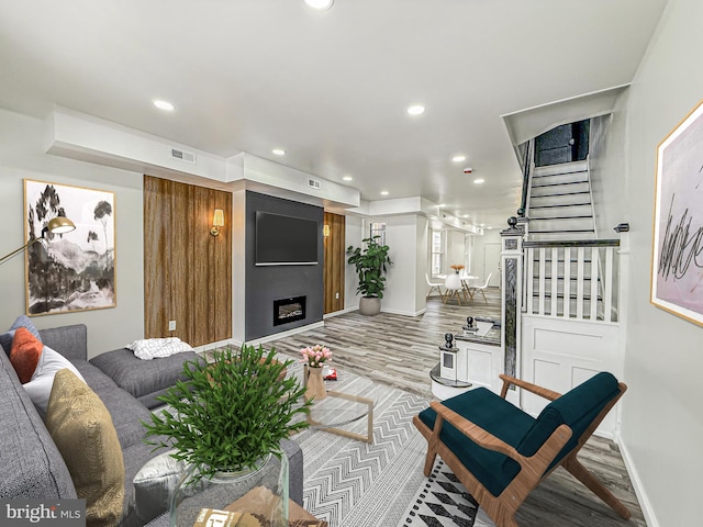 5849 Washington Ave, Philadelphia, PA 19143 - living room featuring recessed lighting, stairway, baseboards, and wood finished floors