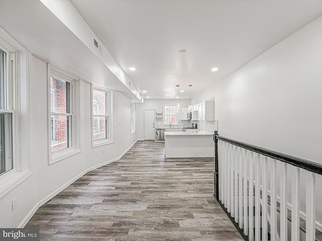 5849 Washington Ave, Philadelphia, PA 19143 - hall featuring light wood finished floors, recessed lighting, and baseboards
