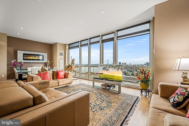 901 N Penn St Unit F2003, Philadelphia, PA 19123 - living area with wood finished floors, floor to ceiling windows, and recessed lighting