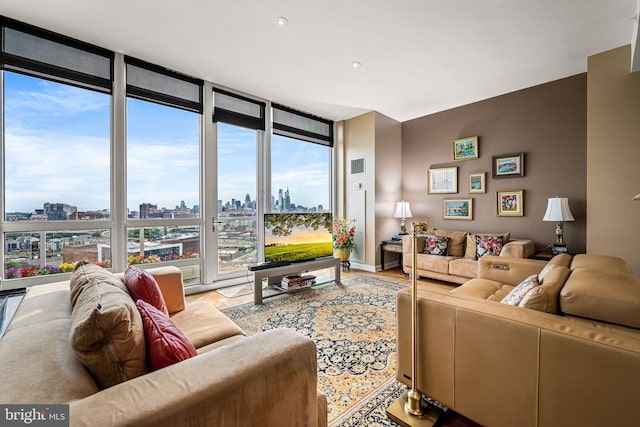 901 N Penn St Unit F2003, Philadelphia, PA 19123 - living room featuring expansive windows, a view of skyline, and light wood-style floors