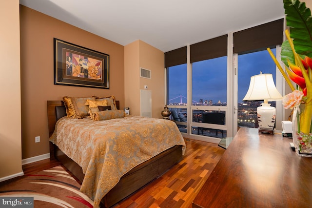 901 N Penn St Unit F2003, Philadelphia, PA 19123 - bedroom with wood finished floors, baseboards, and a view of city