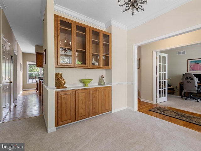 106 Barb Ct, Stephens City, VA 22655 - bar with light colored carpet, ornamental molding, and french doors