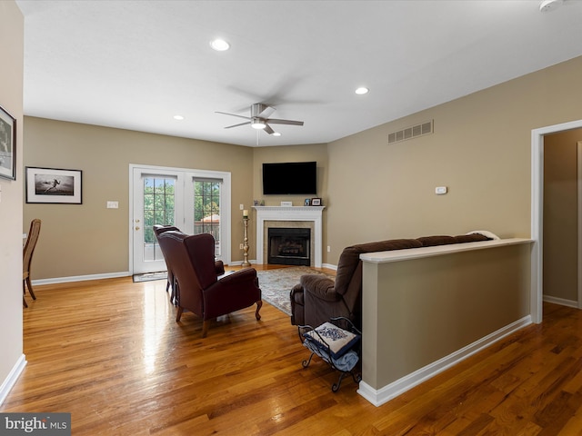 106 Barb Ct, Stephens City, VA 22655 - living room featuring a tile fireplace, a ceiling fan, light wood-type flooring, and recessed lighting
