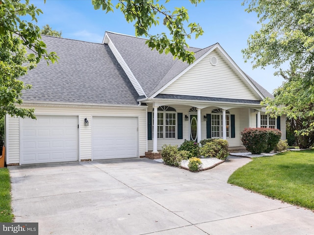 106 Barb Ct, Stephens City, VA 22655 - view of front of home with an attached garage, a porch, driveway, a shingled roof, and a front lawn
