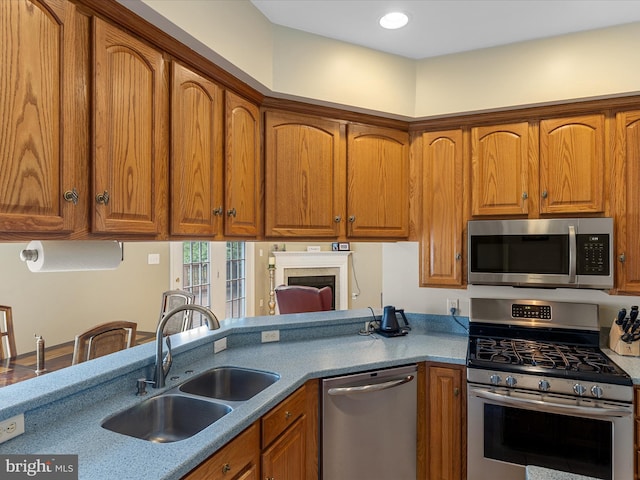 106 Barb Ct, Stephens City, VA 22655 - kitchen featuring appliances with stainless steel finishes, brown cabinetry, and recessed lighting