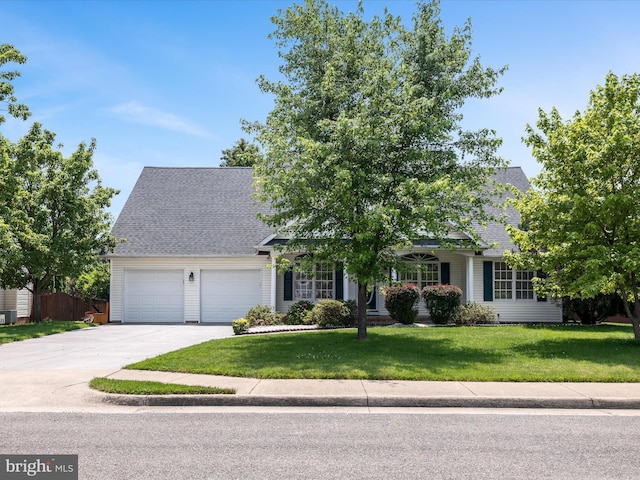 106 Barb Ct, Stephens City, VA 22655 - view of property hidden behind natural elements featuring a front yard, a garage, concrete driveway, and a shingled roof