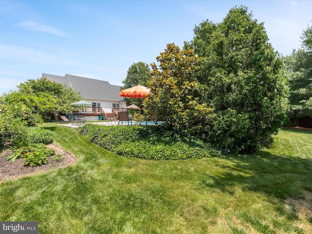 106 Barb Ct, Stephens City, VA 22655 - view of grassy yard featuring a deck and an outdoor pool